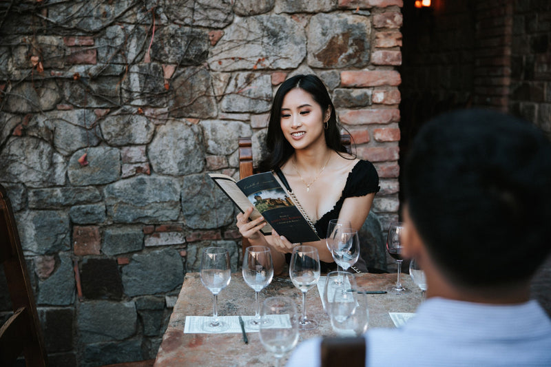 couple-sitting-at-wine-tasting