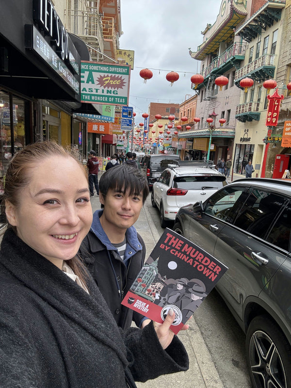 chinatown hand holding booklet