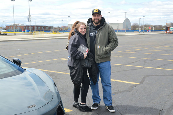 couple with cool car