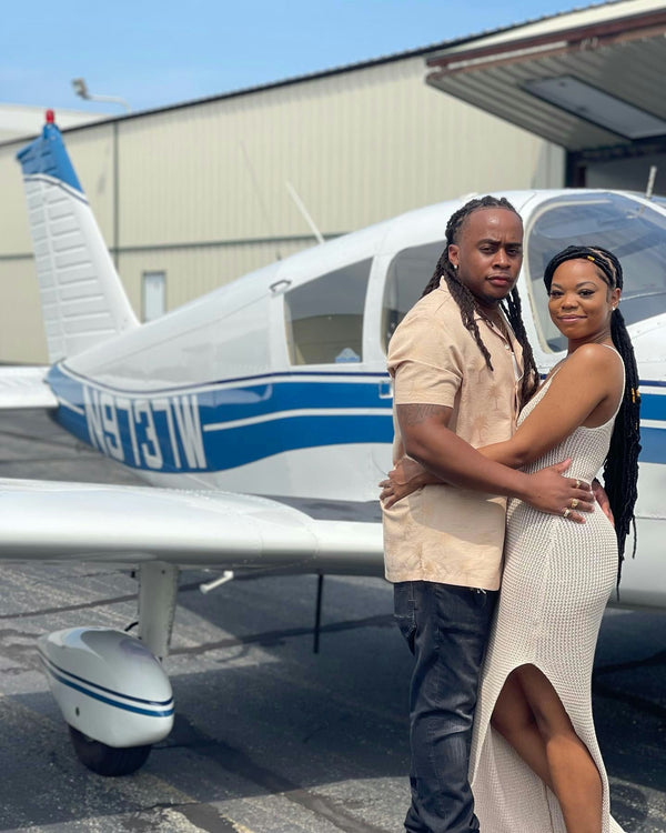 couple with wine & plane