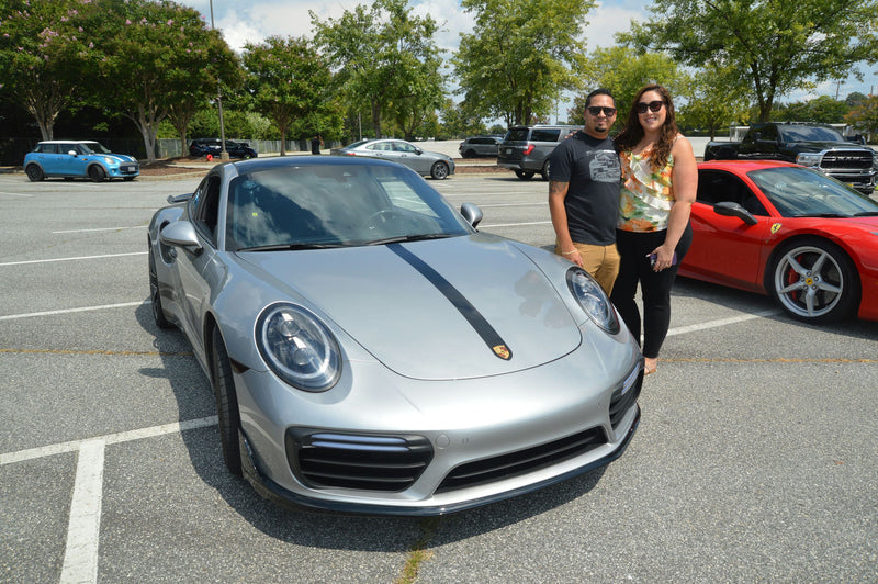 couple with silver car