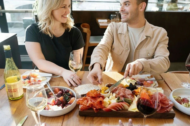 couple with wine and charcuterie