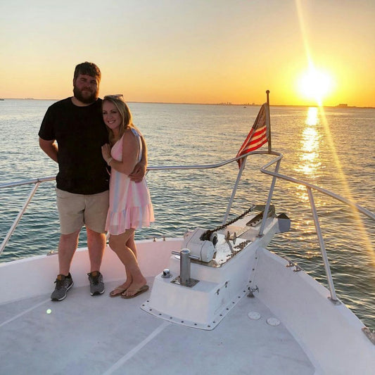 couple on a boat at sunset