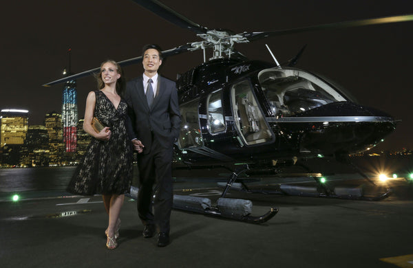 couple outside helicopter