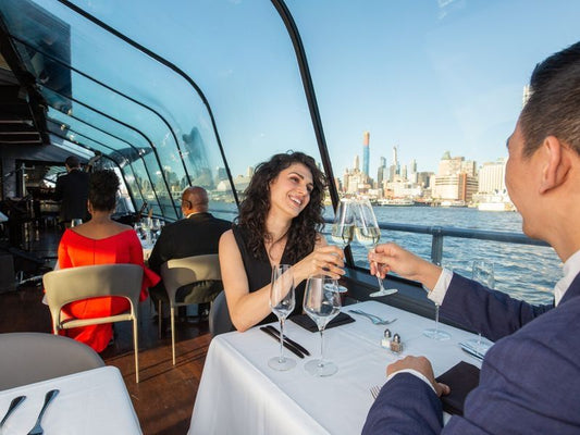 couple toasting on brunch cruise in new york
