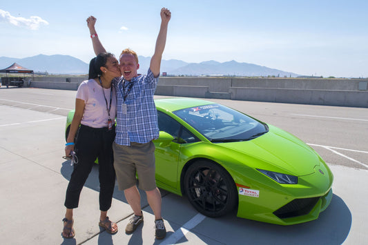couple with green car excited