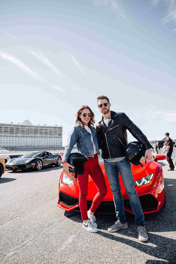 couple with red ferrari