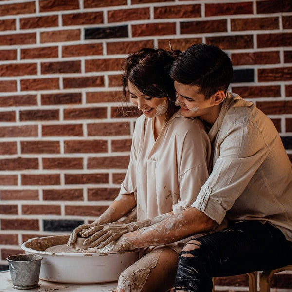 cute couple making pottery