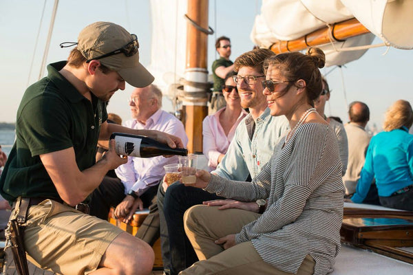 daysail crew pouring drinks.jpeg