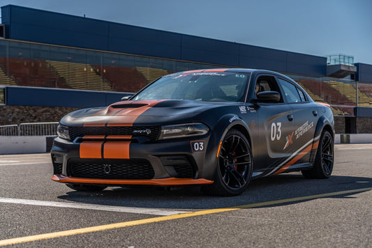 dodge charger hellcat parked black and orange