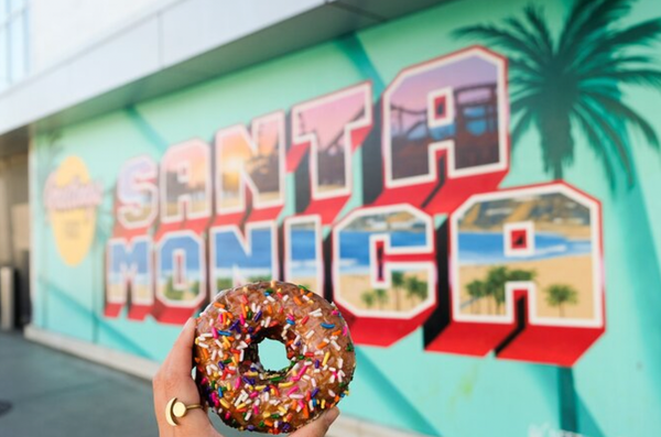 donut in front of santa monica sign