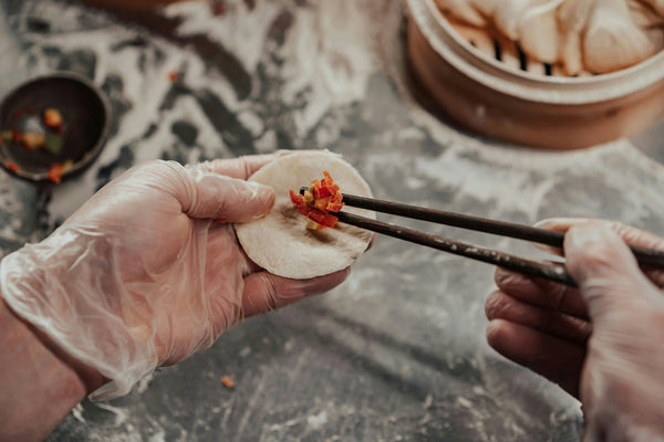 dumpling-with-chopsticks