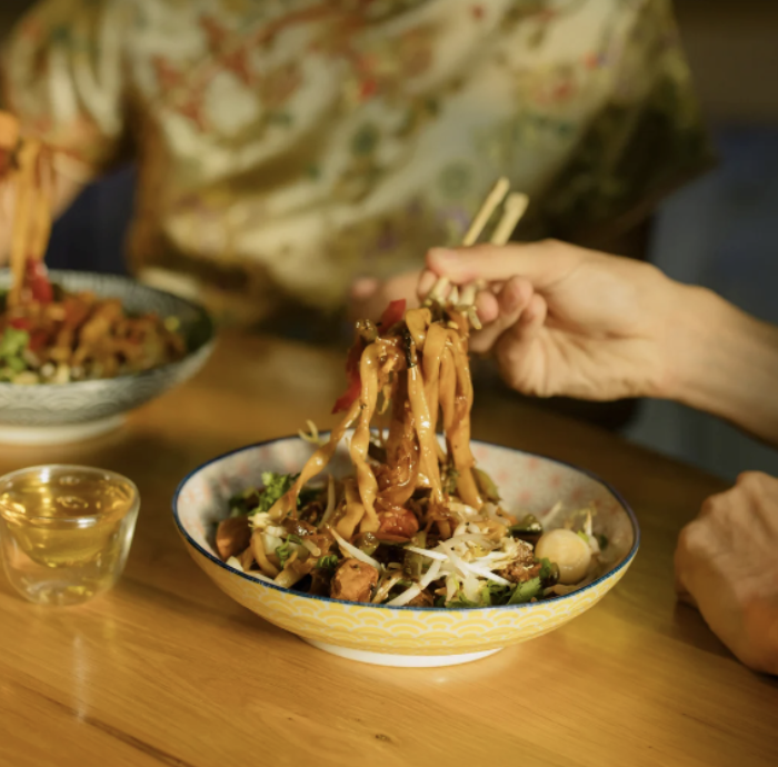 eating noodles with chopsticks