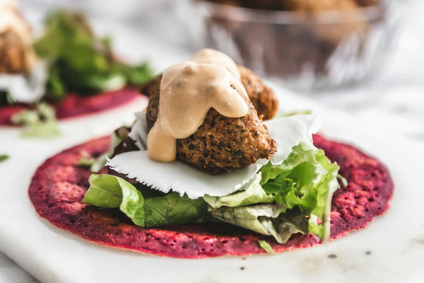 Falafel wrap with beet flatbread, lettuce, and tahini sauce.jpg