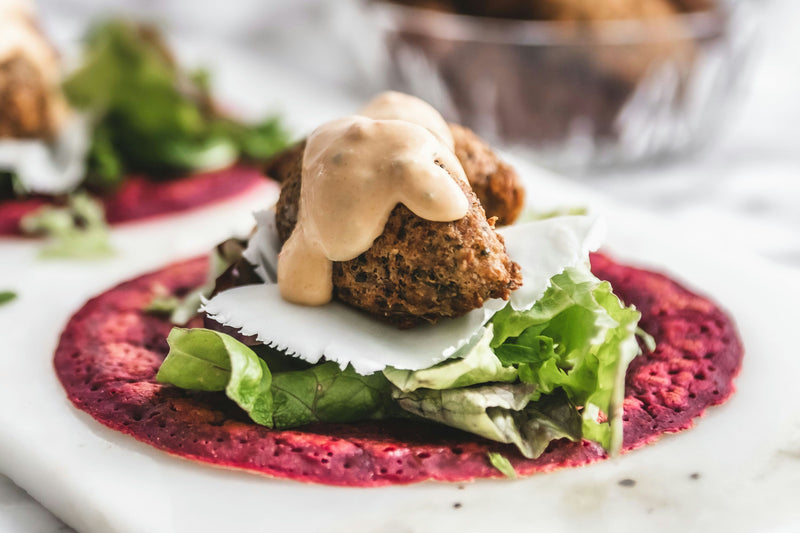 Falafel wrap with beet flatbread, lettuce, and tahini sauce.jpg