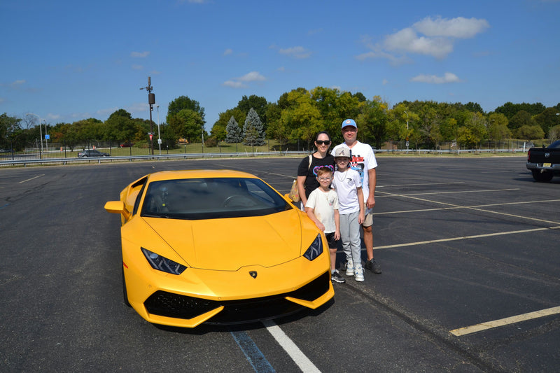 family of 4 with sports car