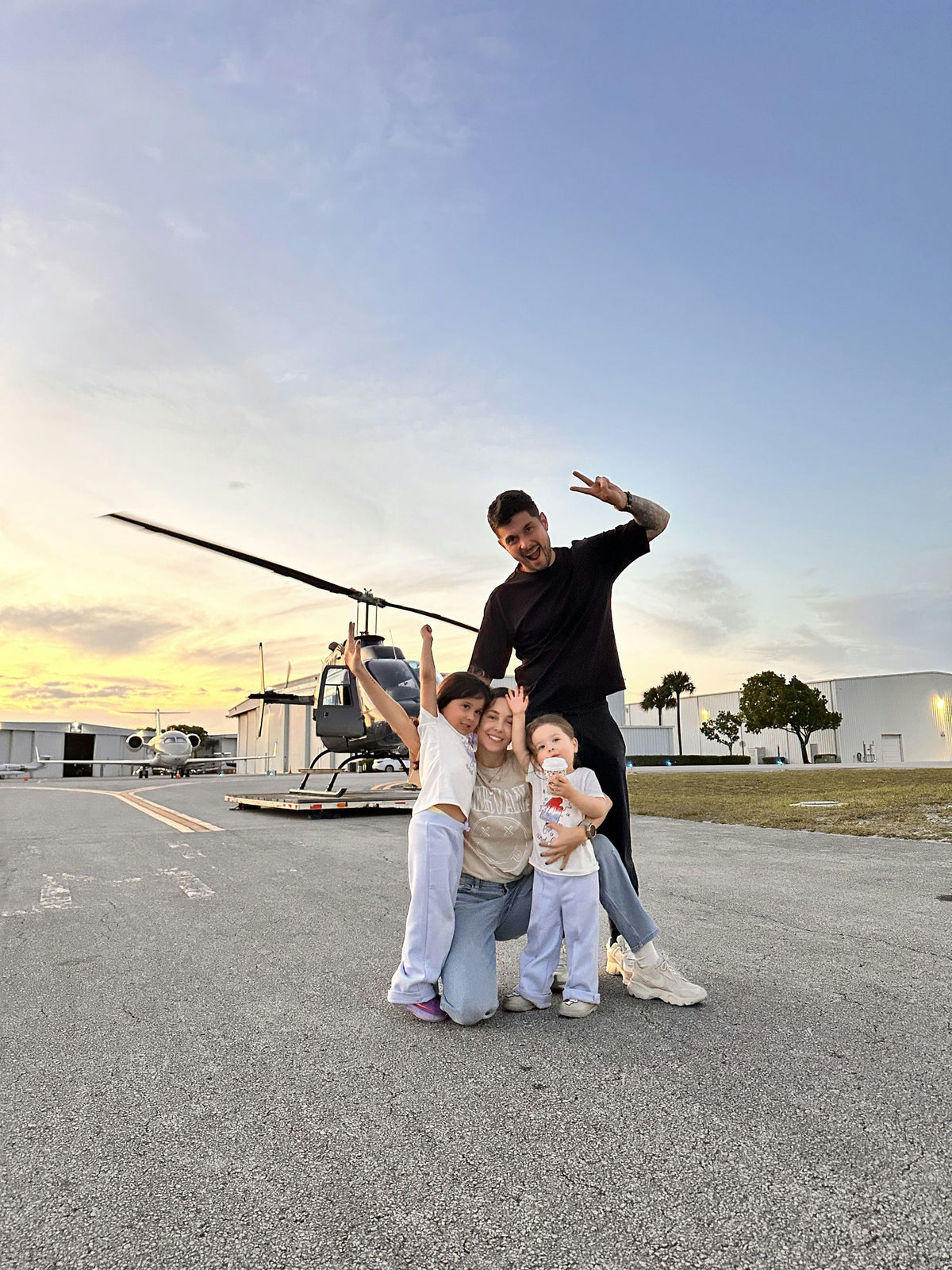 family-with-helicopter-in-background