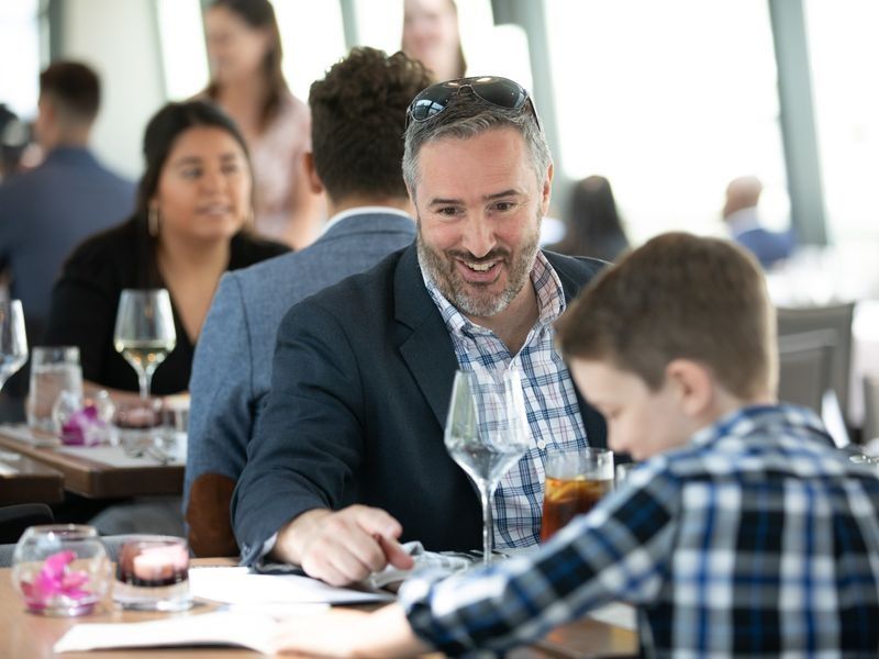 father-and-son-enjoying-brunch-cruise