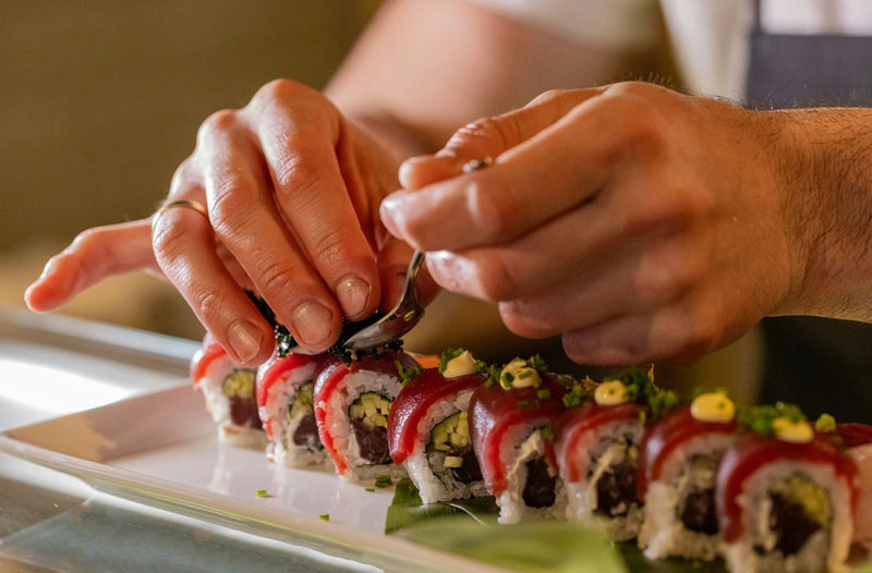 finishing touches on sushi