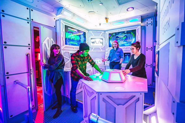 four people in escape room game