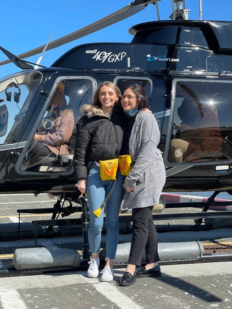 friends-in-front-of-a-helicopter-in-ny