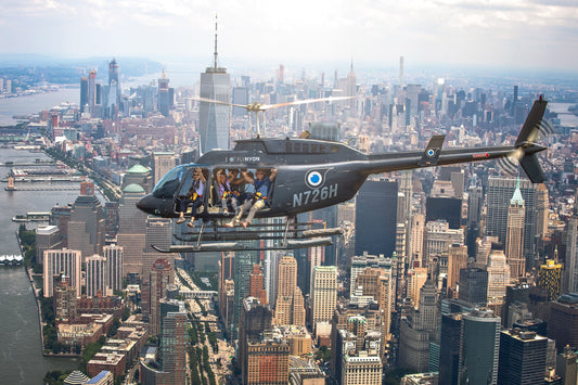 friends in helicopter over new york with doors open