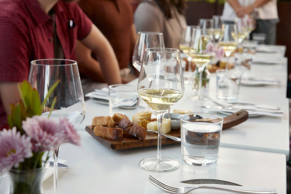 full table of wine and snacks