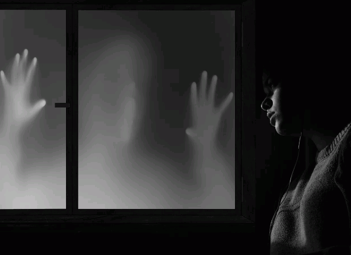 ghost-hands-on-window-with-man-looking