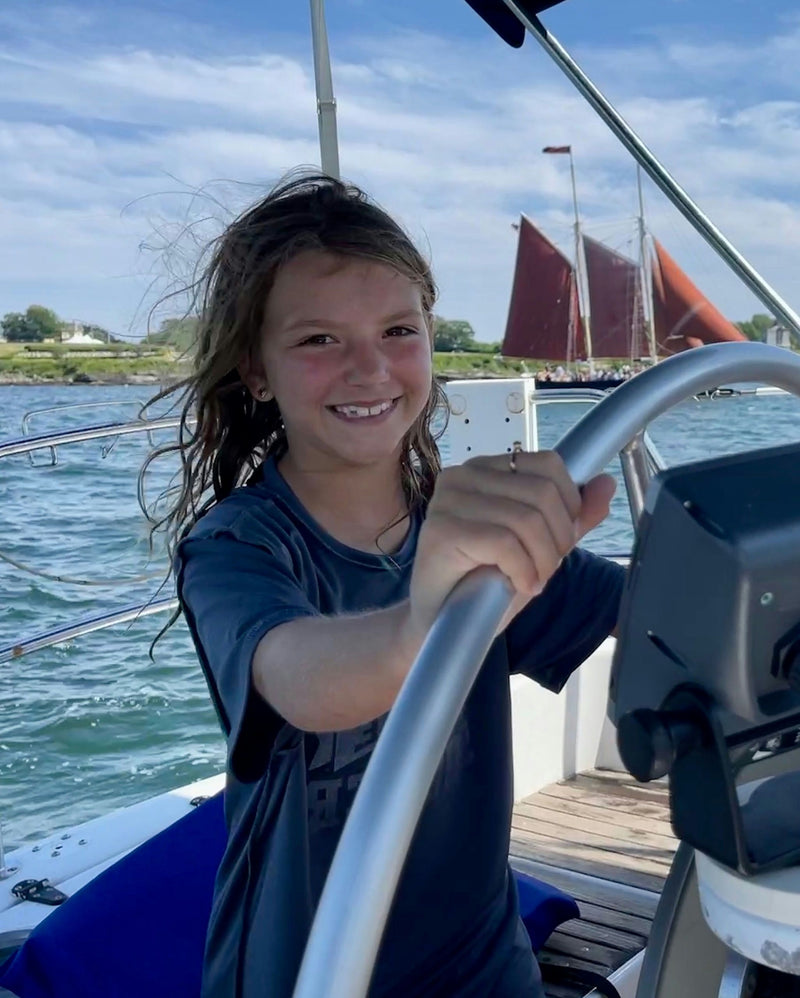 girl-driving-boat-jpeg