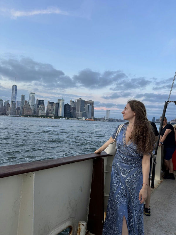 sailboat with statue of liberty