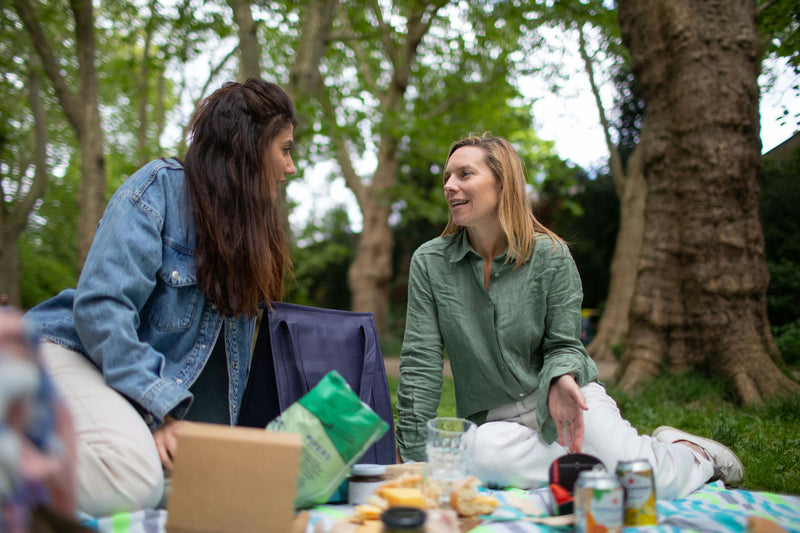 girls-talking-and-enjoying-picnic