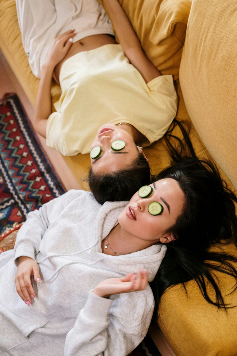 girls with cucumbers on eyes