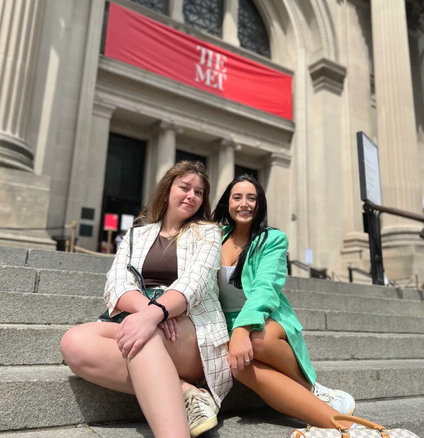 girls sitting on famous stairs