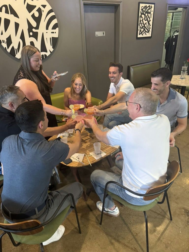 group cheers at table