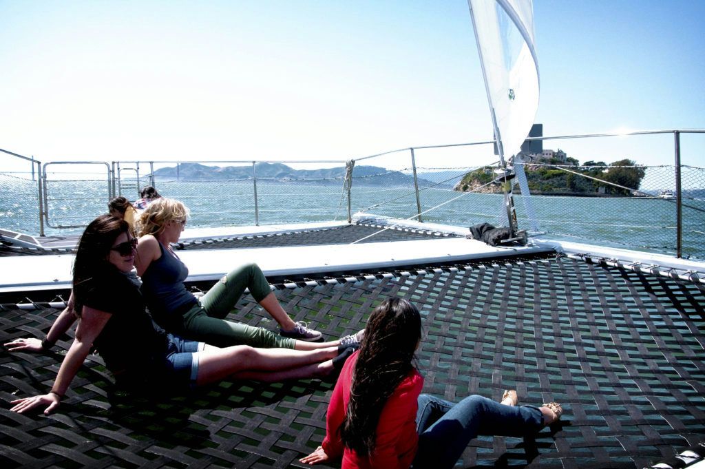 group-lying-on-trampoline-on-a-boat-jpg