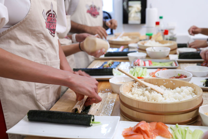 group making sushi