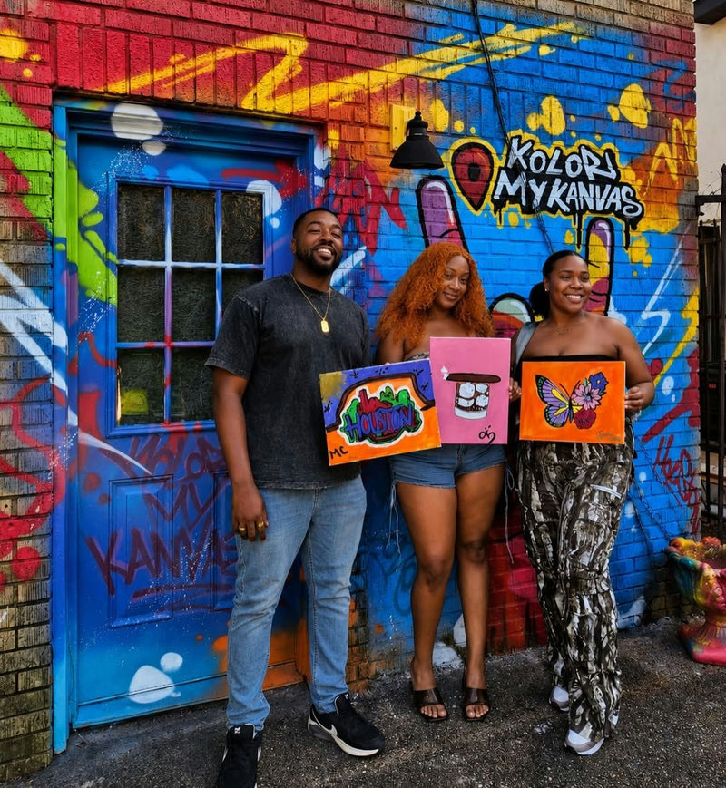 group of 3 holding canvases