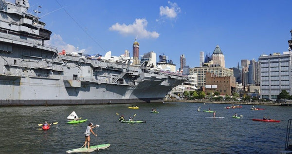 group-of-kayakers-and-paddle-boarders