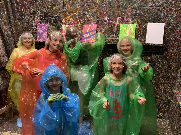group-of-kids-in-splatter-paint-room