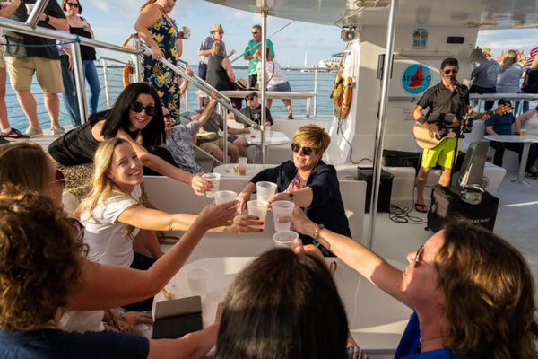 group-saying-cheers-on-a-boat