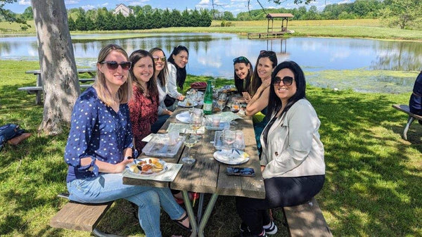 group sitting at picnic table