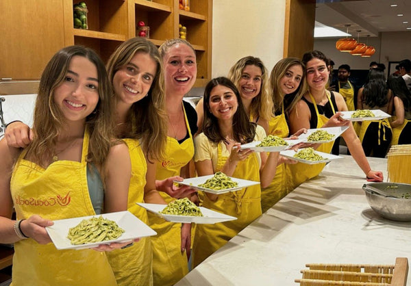 group with plated pasta
