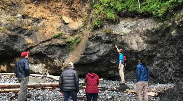 guide-pointing-at-rock