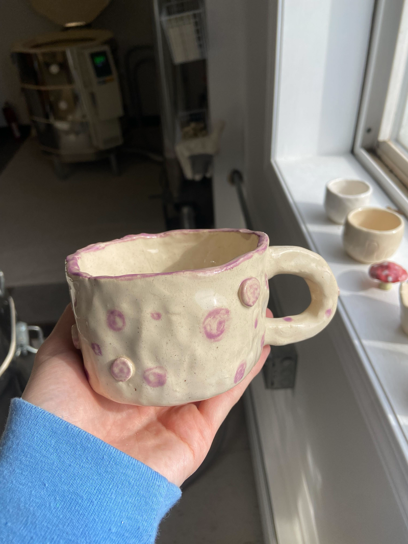 hand holding mug