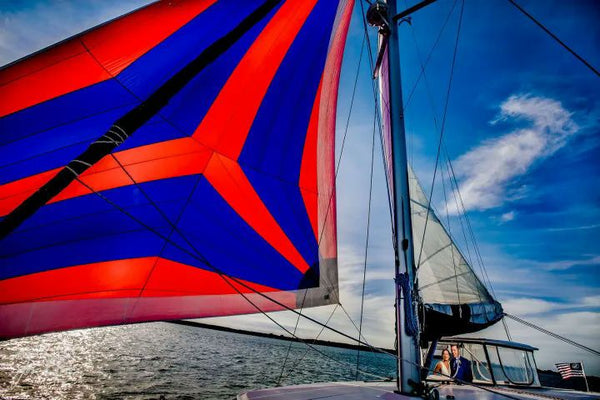 happy friends on sailboat