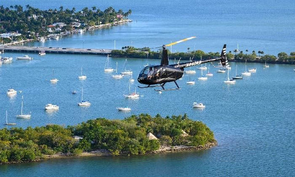 helicopter-hovering-around-coast-of-florida-above-water-and-boat