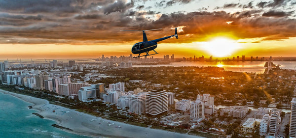 helicopter over florida beach at sunset