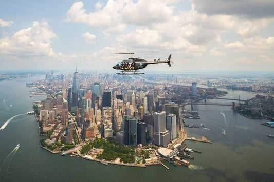 woman looking out helicopter over new york