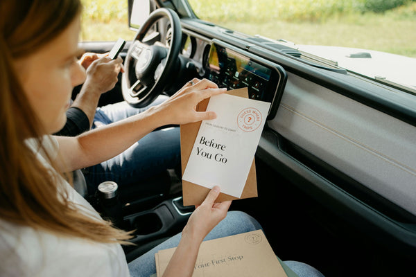 holding the before you go kit in jeep