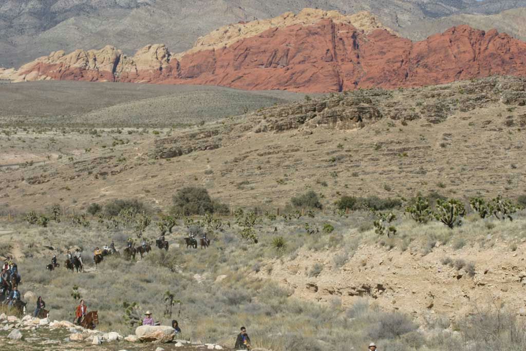 horseback-riding-through-desert